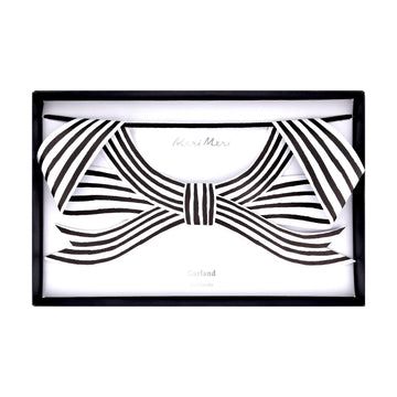 Black and white bow tie design in a decorative frame on a white background