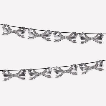 Decorative string with bow-shaped ornaments on a white background
