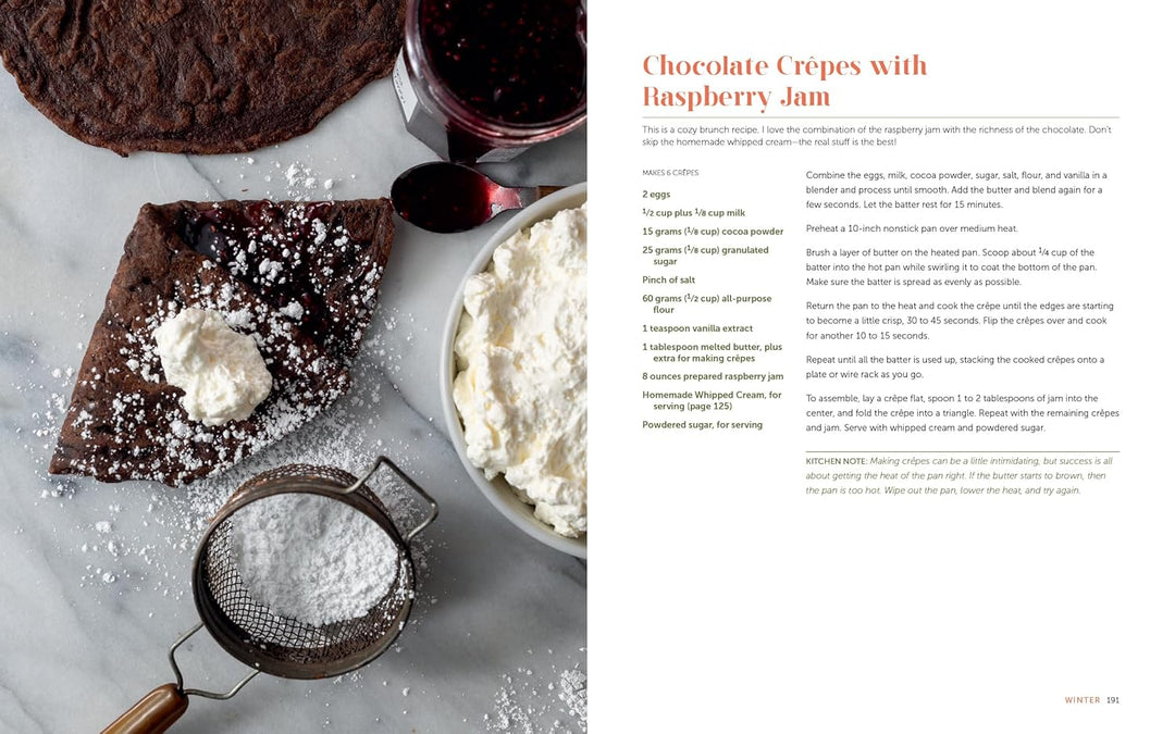 Chocolate crepes with raspberry jam and whipped cream on a marble surface, accompanied by a recipe on the right.