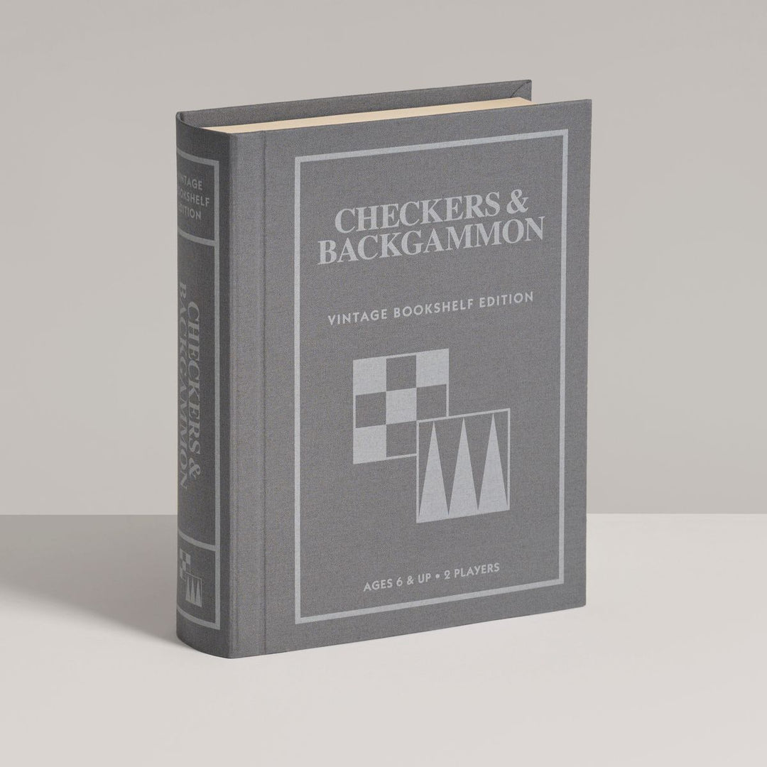 Gray book-shaped checkers and backgammon set on a light gray background