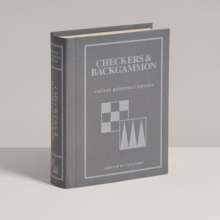 Gray book-shaped checkers and backgammon set on a light gray background