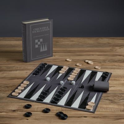 Backgammon set with pieces and board on a wooden surface
