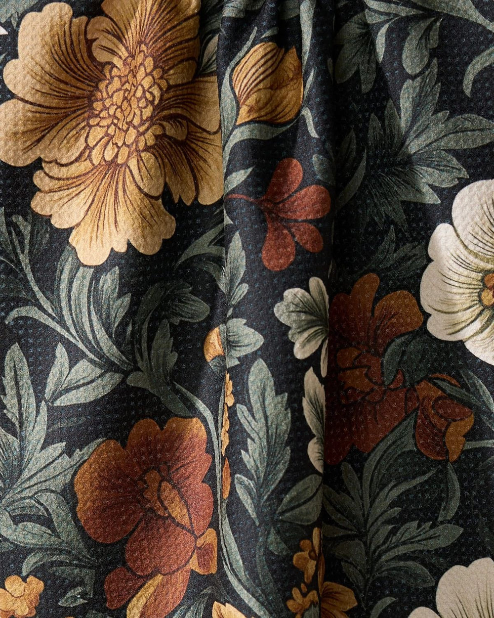 Close-up of floral fabric with dark background