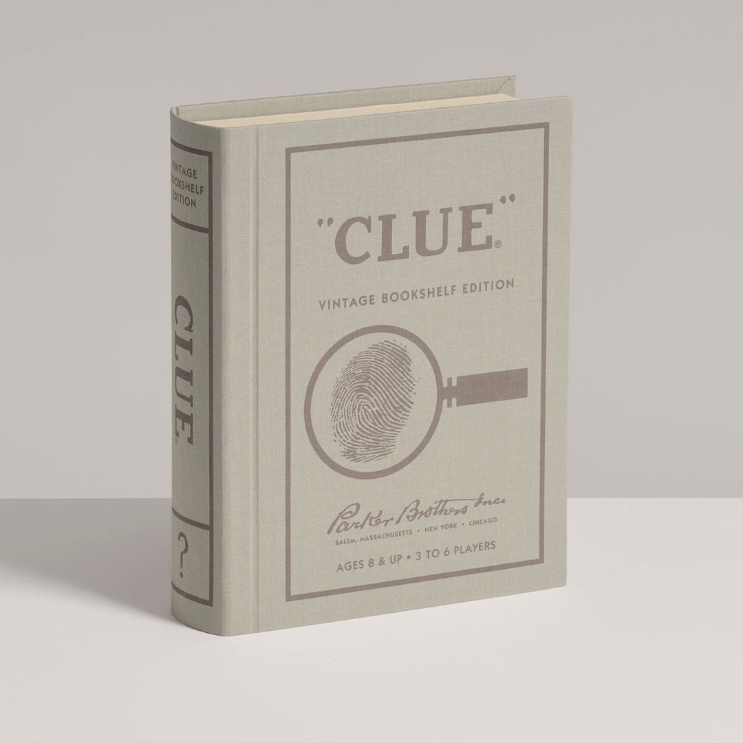 Book titled 'Clue' with vintage design on a gray background