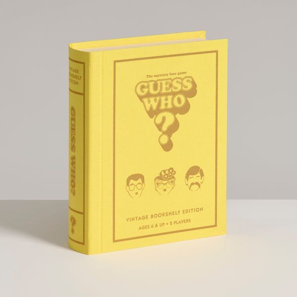 Yellow book titled 'Guess Who?' on a light gray background