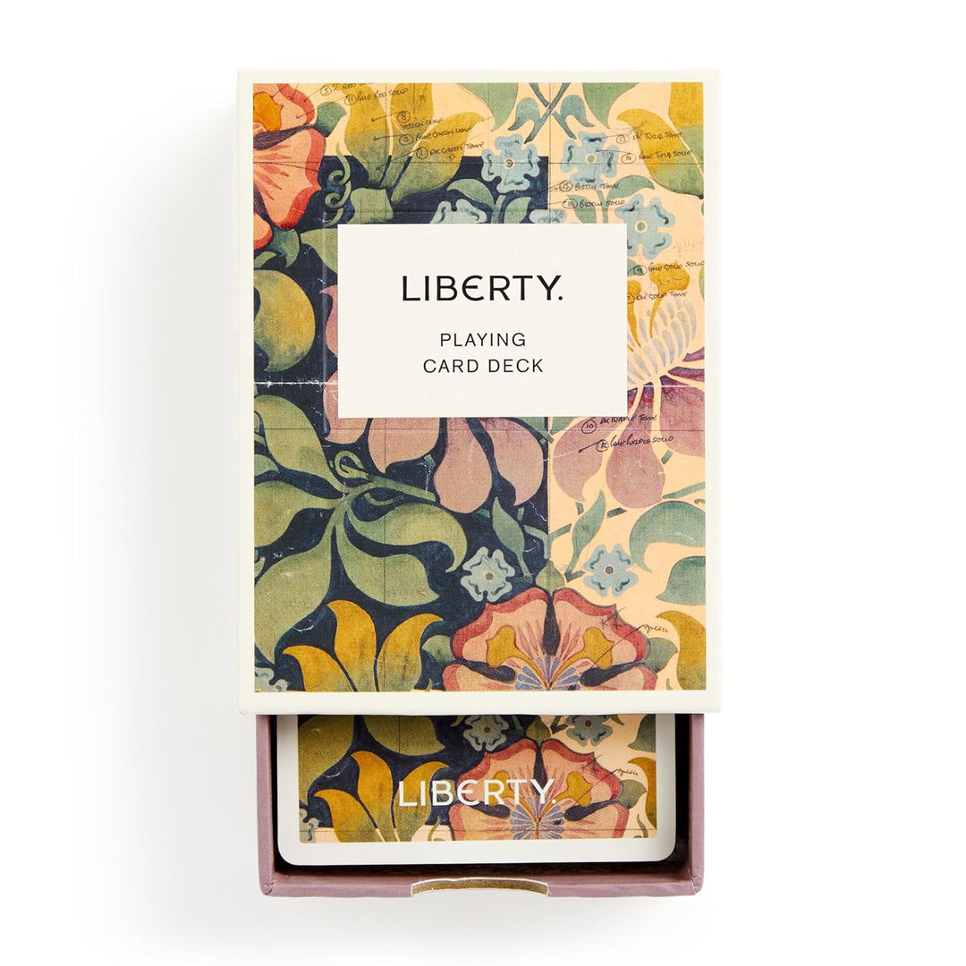 Floral-patterned playing card deck with 'Liberty' branding on a white background