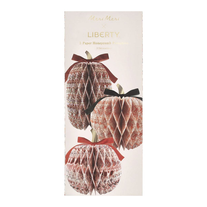 Packaging of Liberty paper honeycomb decorations with ribbons on a white background