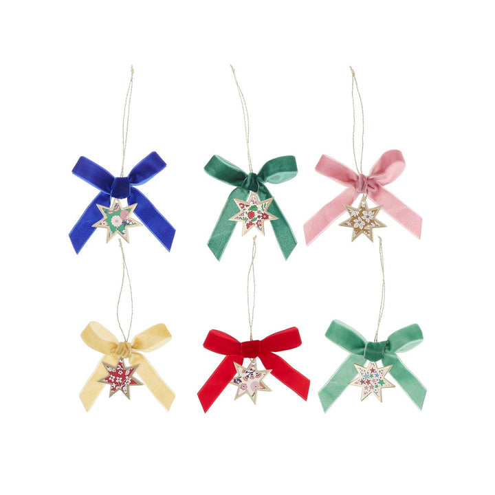 Set of colorful bow-shaped Christmas ornaments with star decorations on a white background