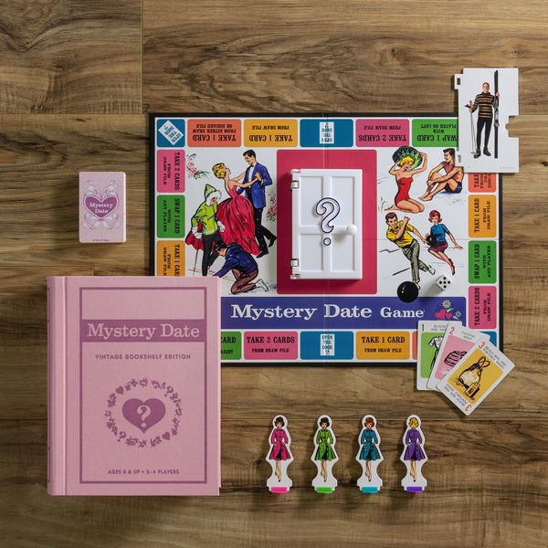 Mystery Date game set on a wooden surface with cards and character figures.
