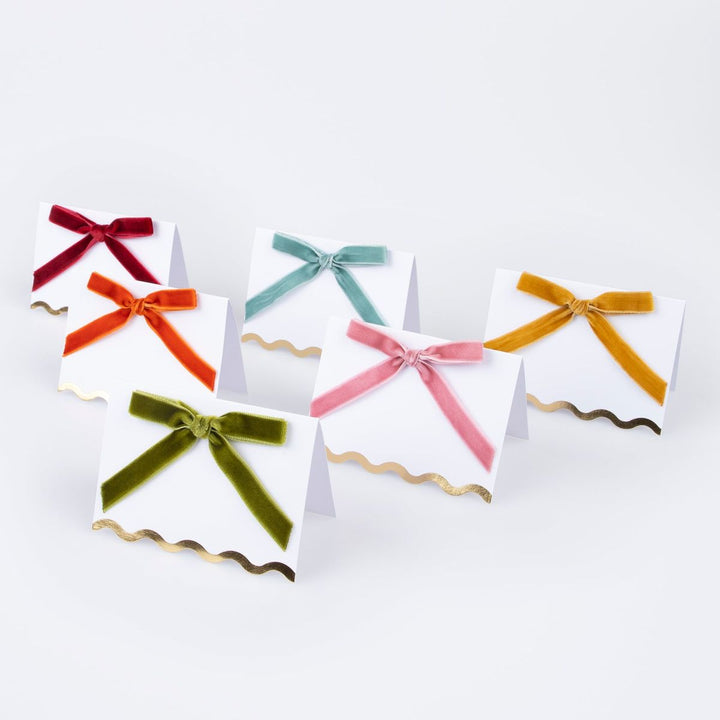 Set of white gift boxes with colorful ribbons on a white background