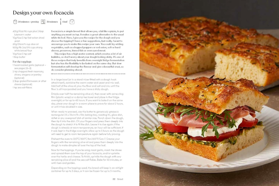 Focaccia bread with a sandwich on a plate next to text on a computer screen.