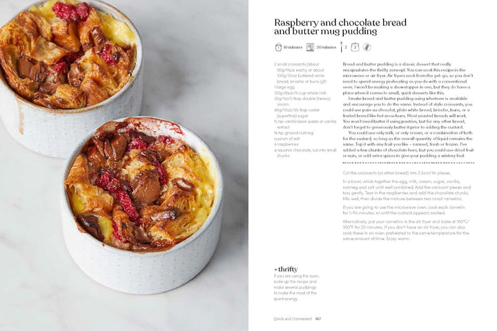 Two ramekins of raspberry and chocolate bread and butter pudding on a light background.