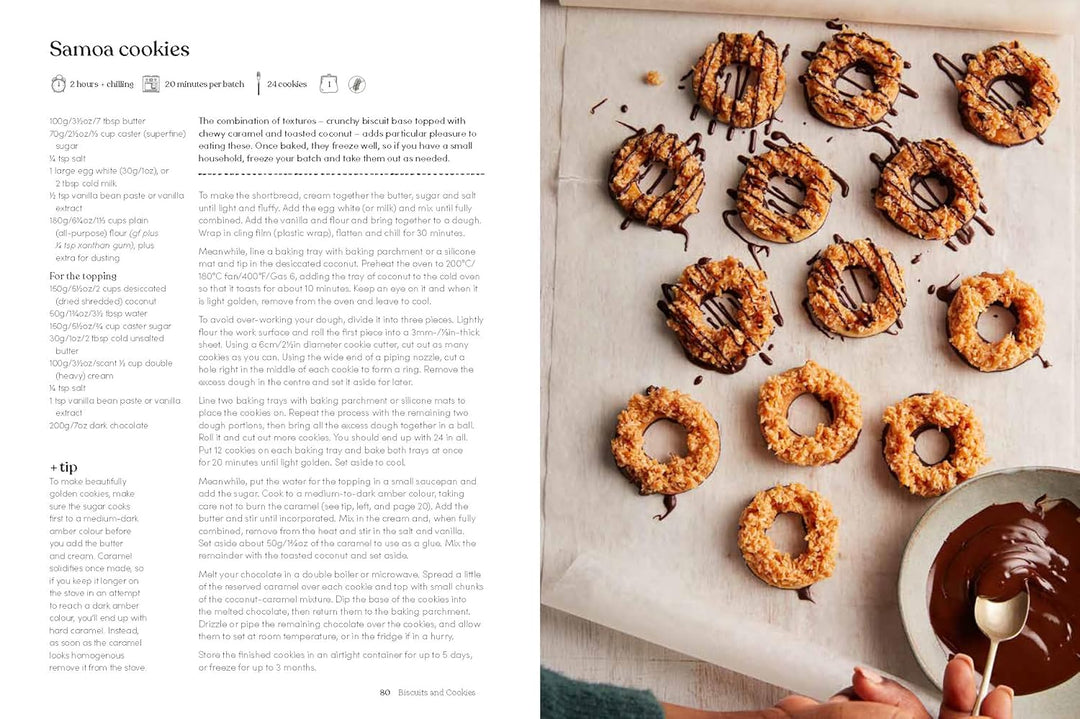 Samoa cookies on a baking sheet with a recipe on the left side.