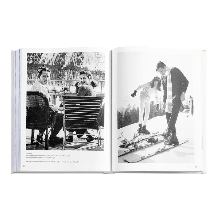 Open book showing black and white photos of people in a snowy landscape.