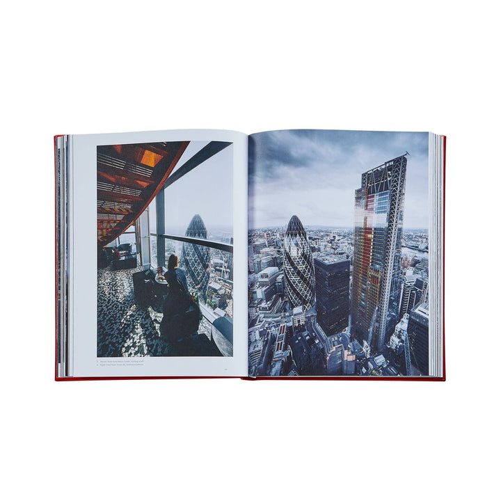 Open book showing a cityscape with modern buildings