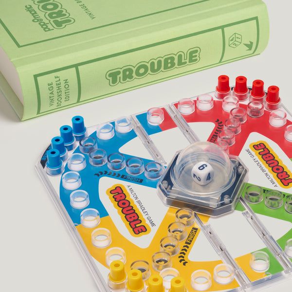 Trouble board game set with dice and pieces on a white background