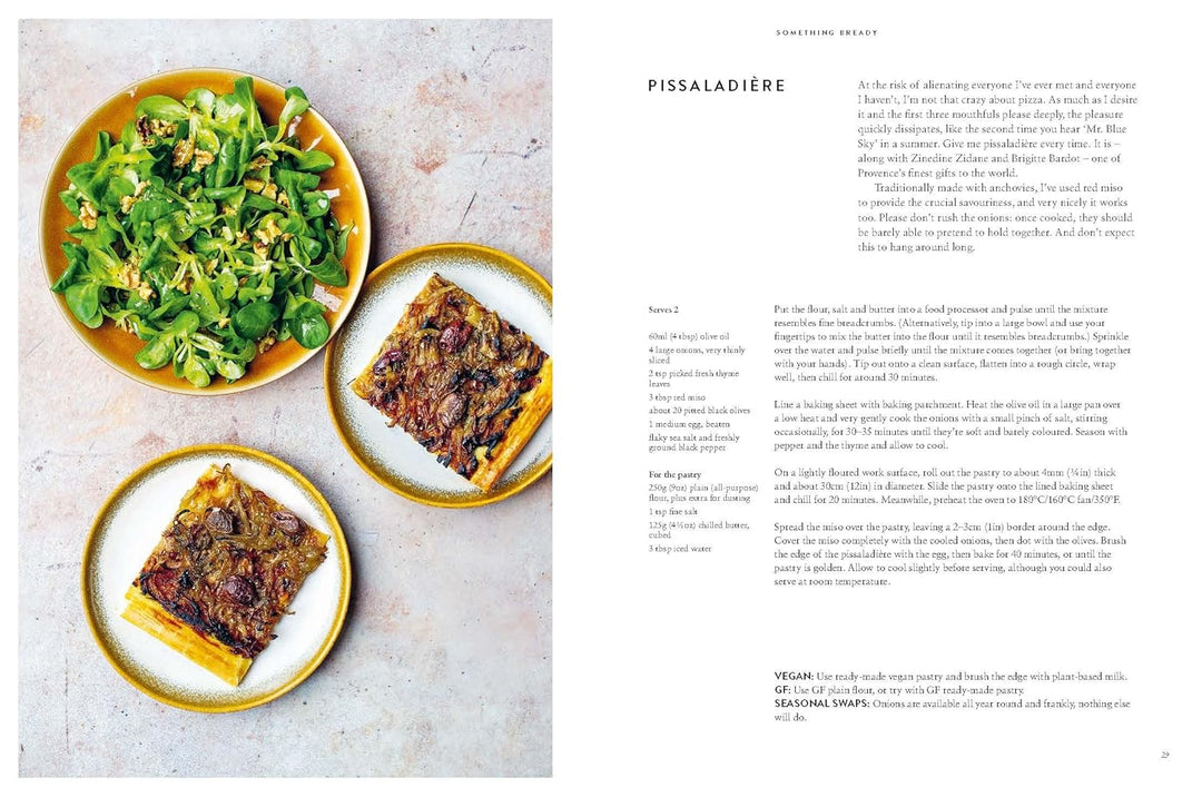 Plates of food and a salad on a textured surface with text on the right.