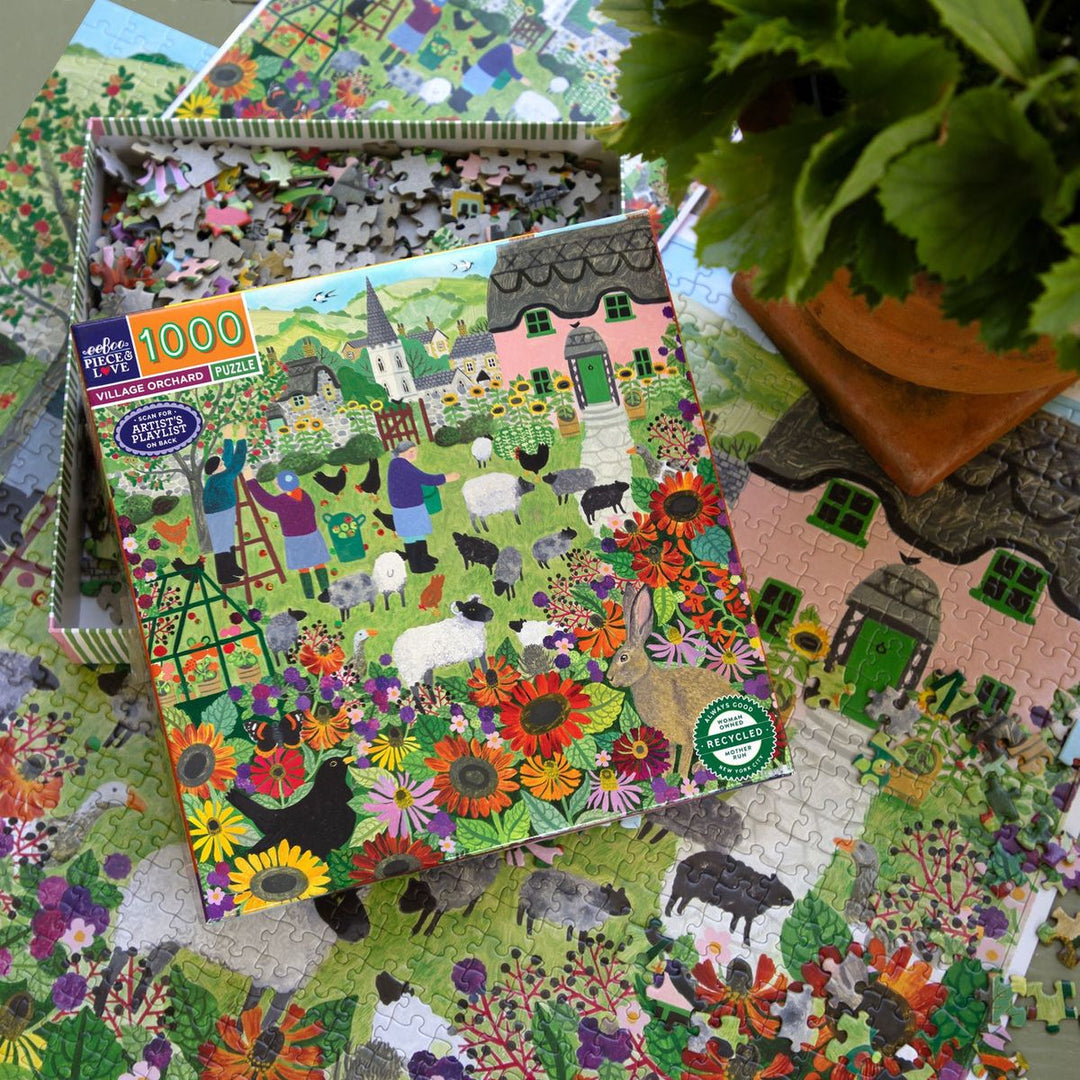 Jigsaw puzzle with colorful design of a village scene, partially completed on a surface with a plant.