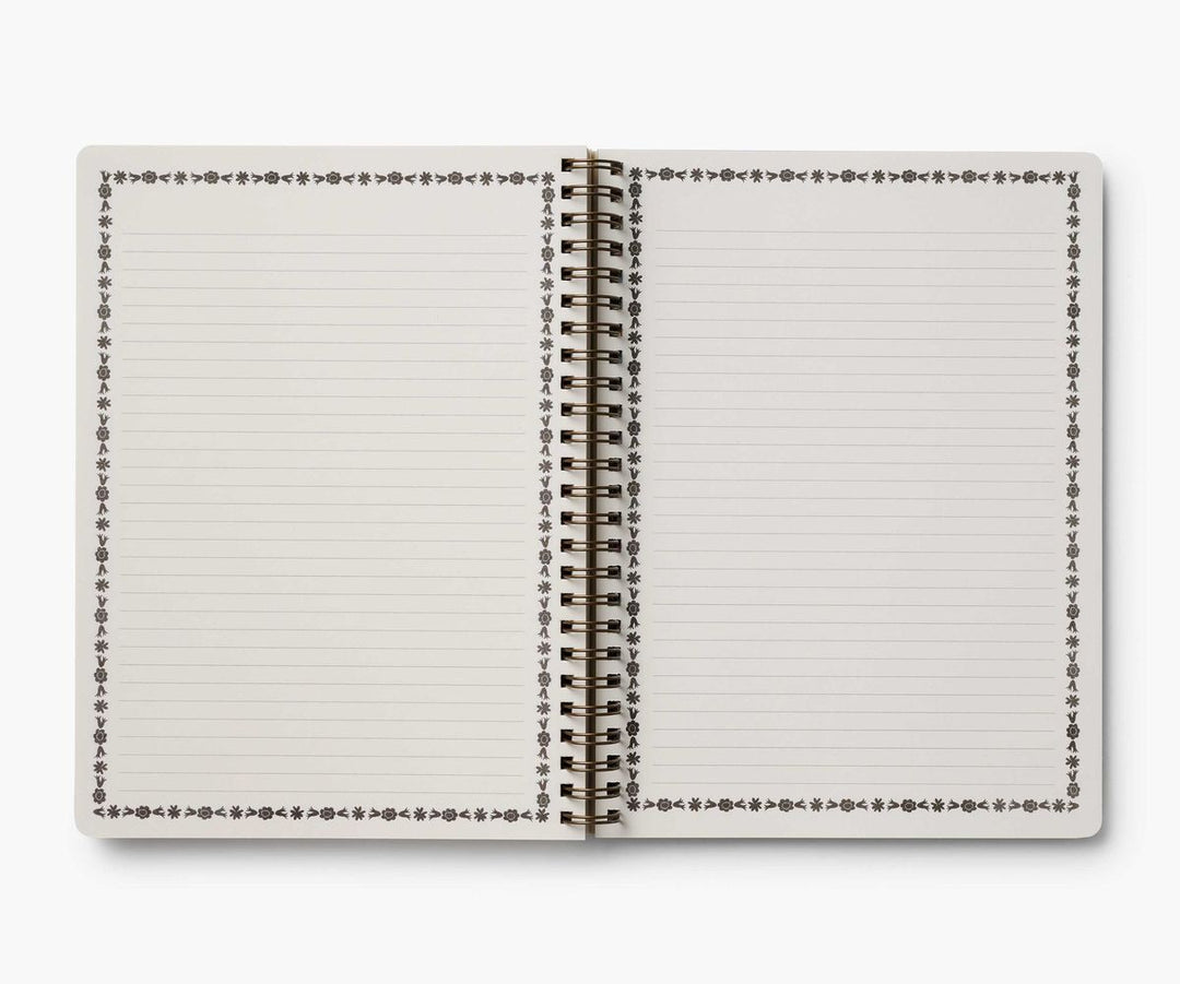 Open notebook with lined pages on a white background