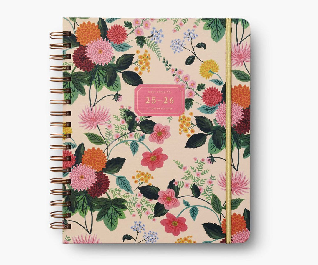 Floral patterned notebook with a pink label on a white background