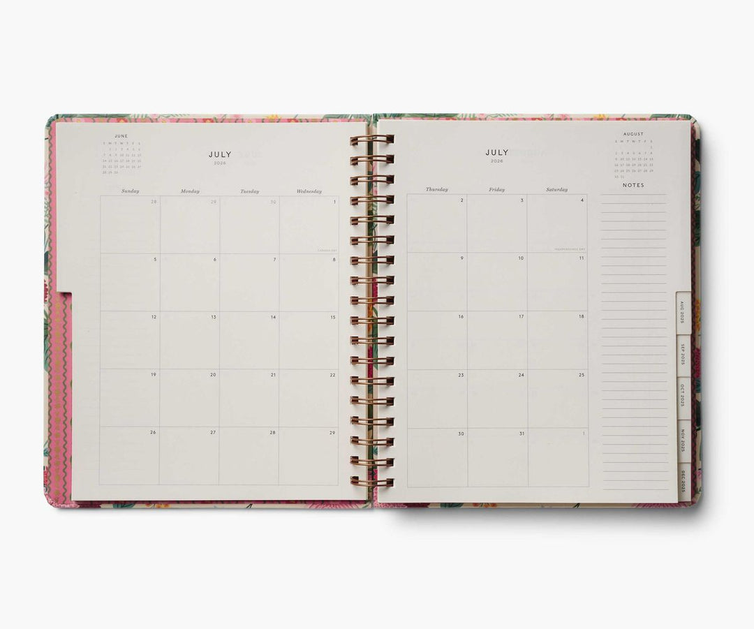 Open planner with monthly calendar and notes section on a white background
