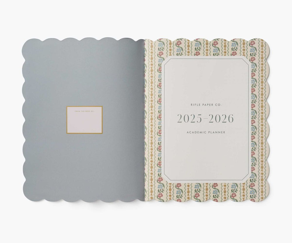Planner with decorative cover and visible brand name on a white background
