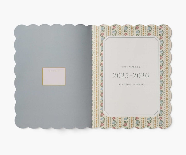 Planner with decorative cover and visible brand name on a white background