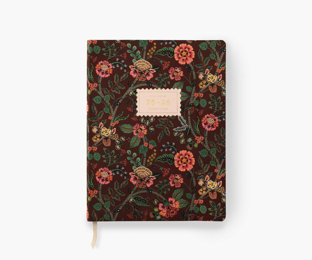 Floral patterned notebook with a white label on a white background