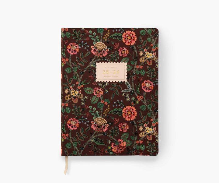 Floral patterned notebook with a white label on a white background
