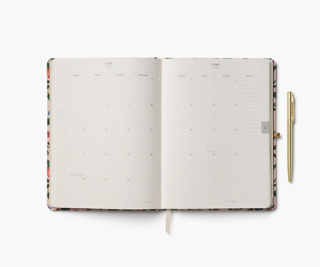 Open planner with floral design on a white background