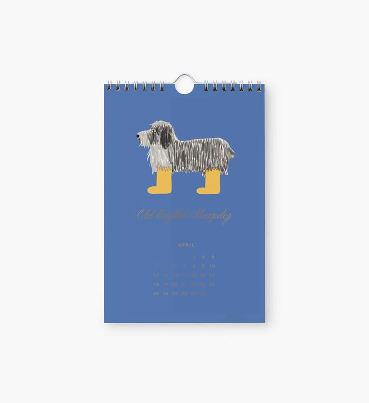 A spiral-bound calendar page or wall calendar cover shown upright on a light gray background. The front is blue and features an illustration of a long-haired dog wearing yellow rain boots, with the text 'The English Bulldog' and a small monthly calendar grid below.