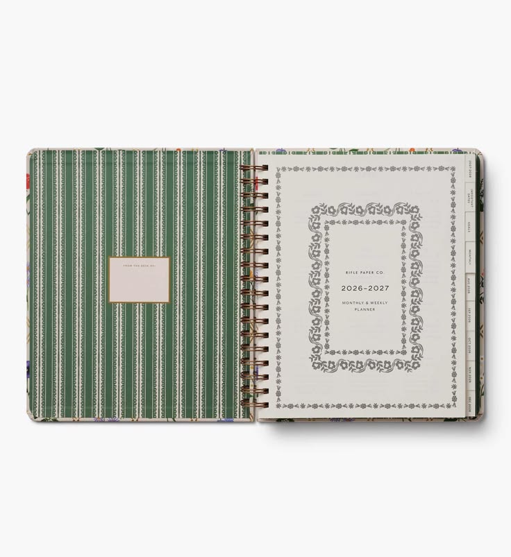 Green striped planner with decorative cover on a white background