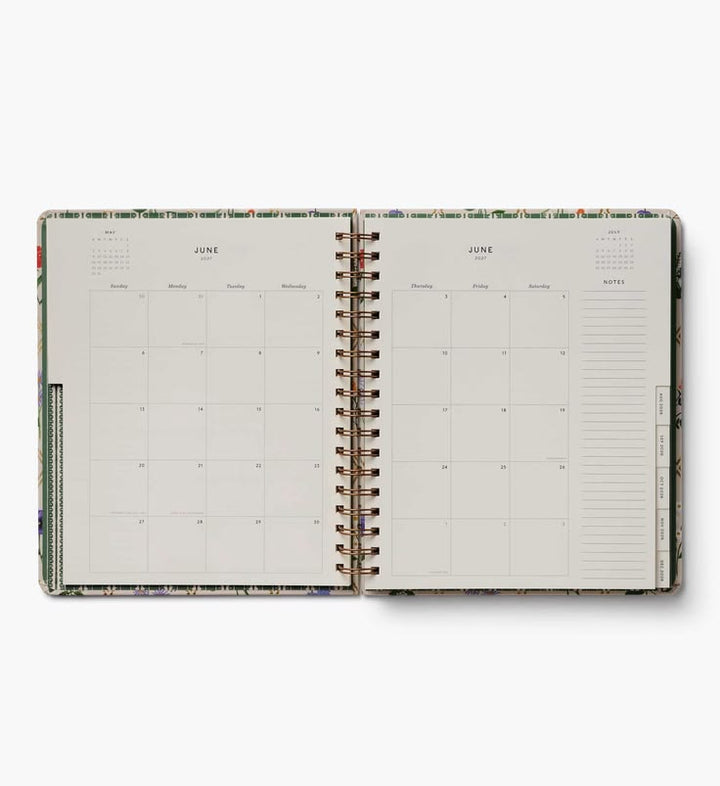 Open planner with monthly view on a white background