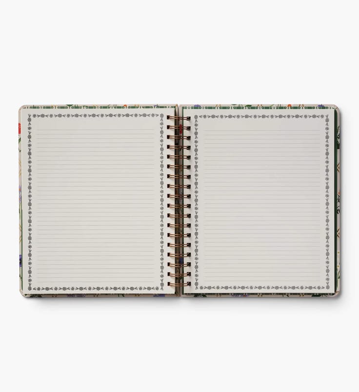 An open spiral-bound notebook with lined pages, featuring a decorative border design on the cover and page edges, photographed on a clean white background.