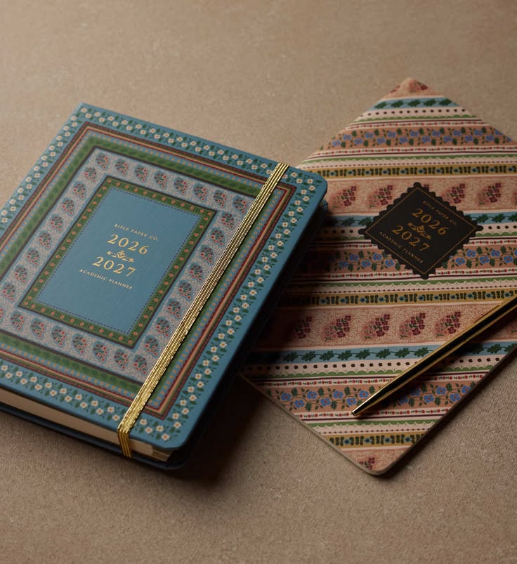 Decorative planner with a pen on a textured surface