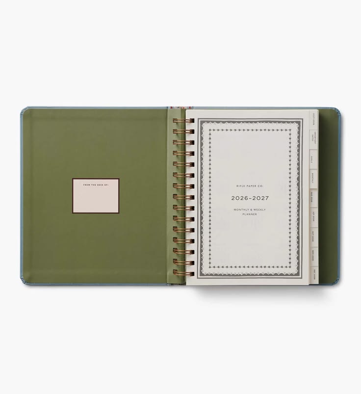 Green planner with a white interior on a white background