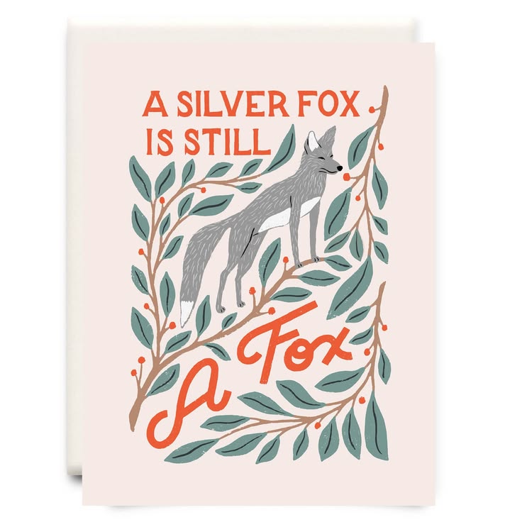 A greeting card featuring an illustration of a silver fox surrounded by green leaves and orange text that reads 'A SILVER FOX IS STILL A Fox'.