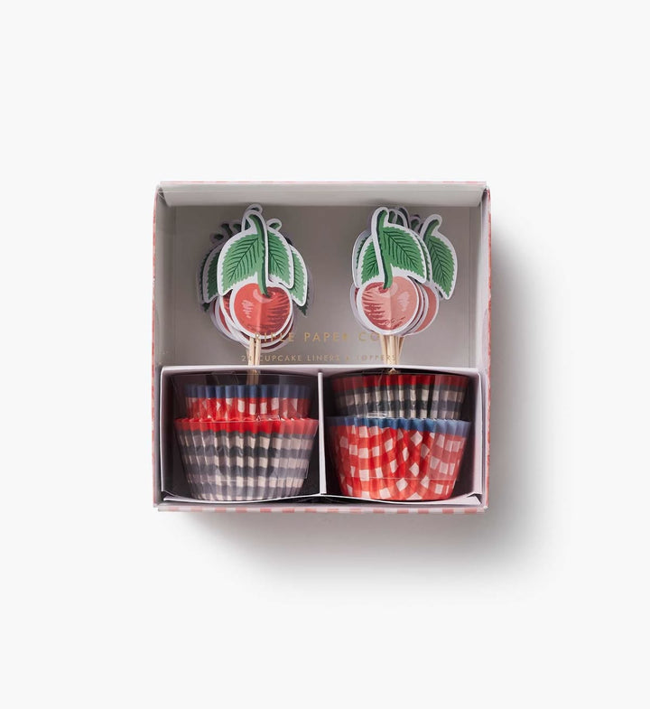 Set of two small ceramic cups with checkered patterns in a decorative box.
