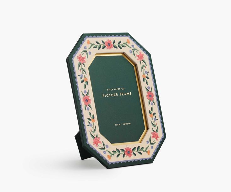 Decorative picture frame with floral design on a white background