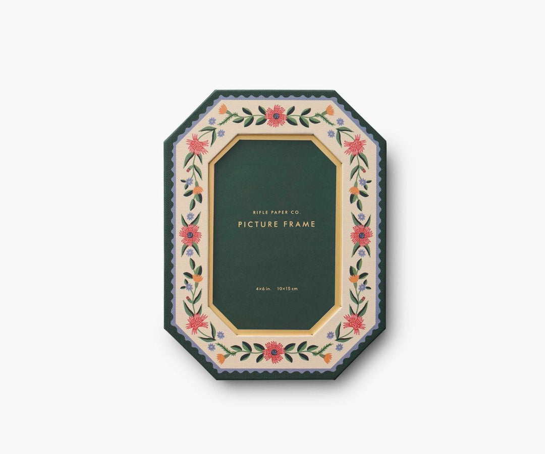 Decorative picture frame with floral design on a white background