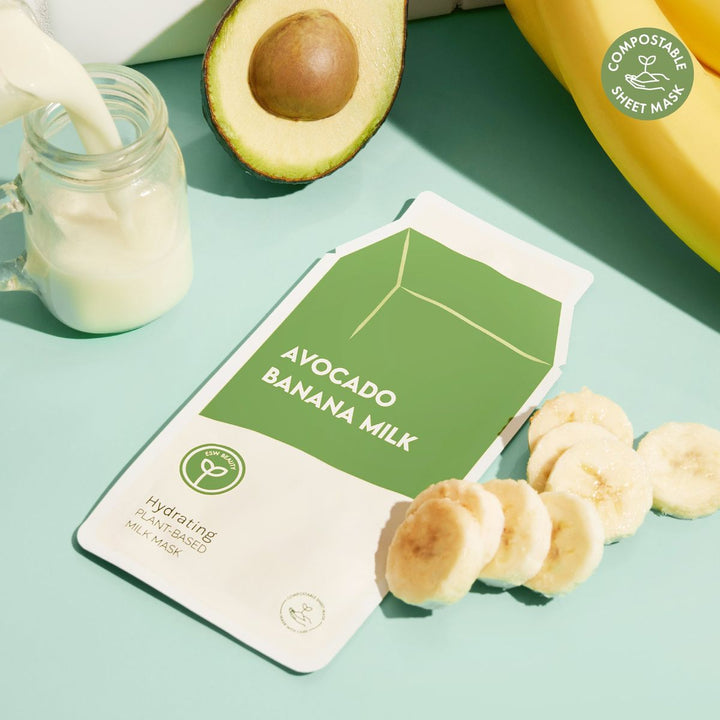 Avocado banana milk packaging with ingredients on a light green background