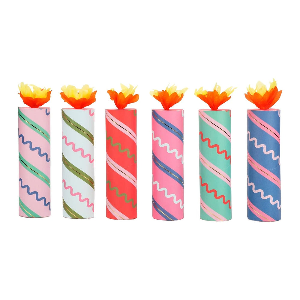Set of colorful candles with wavy patterns on a white background