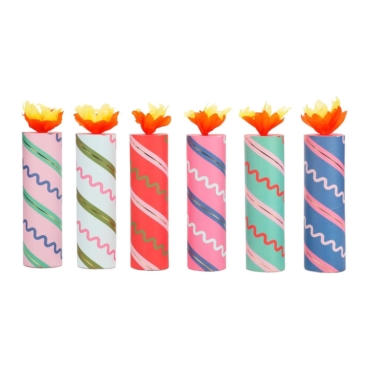 Set of colorful candles with wavy patterns on a white background