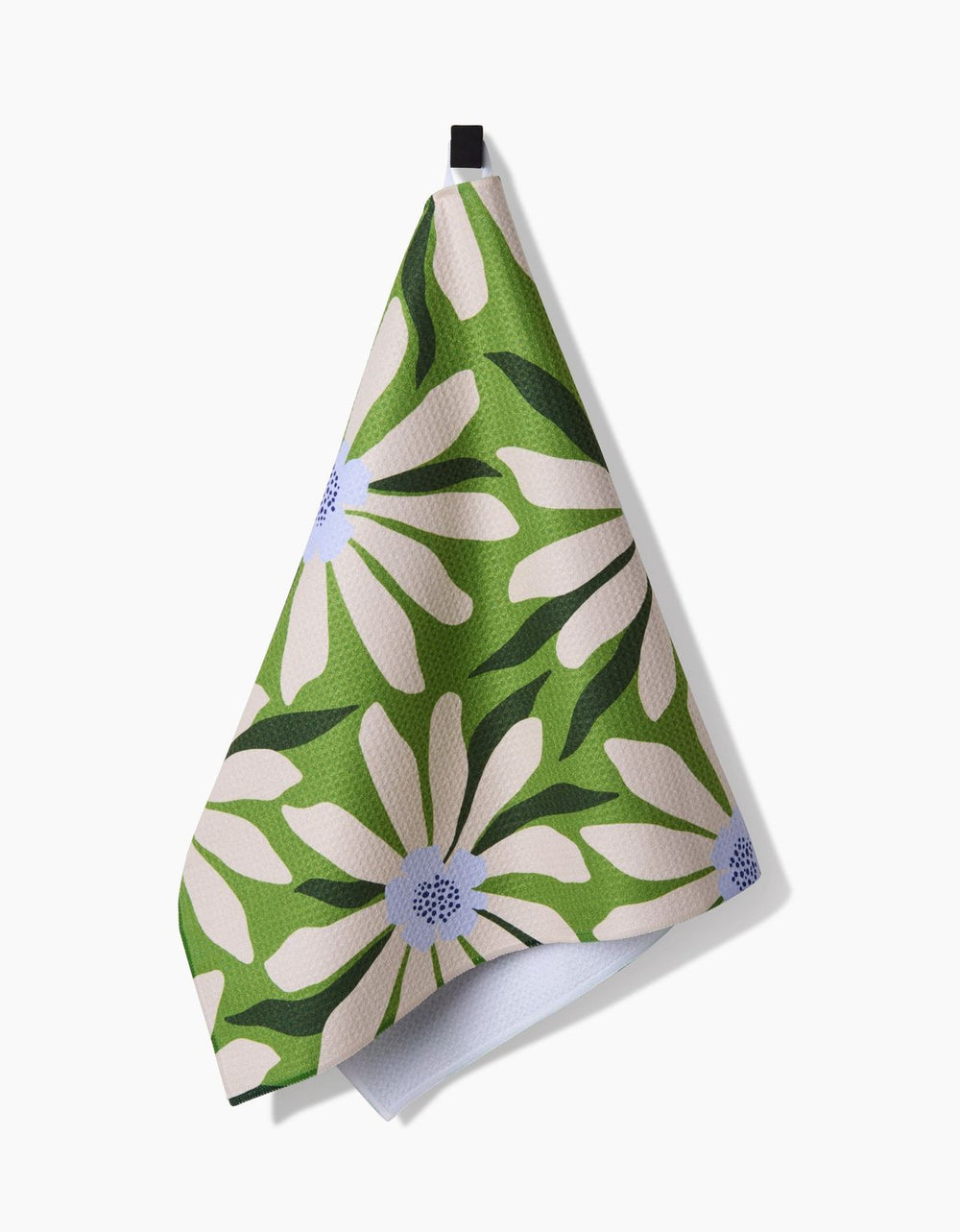 Green and white floral patterned towel on a white background
