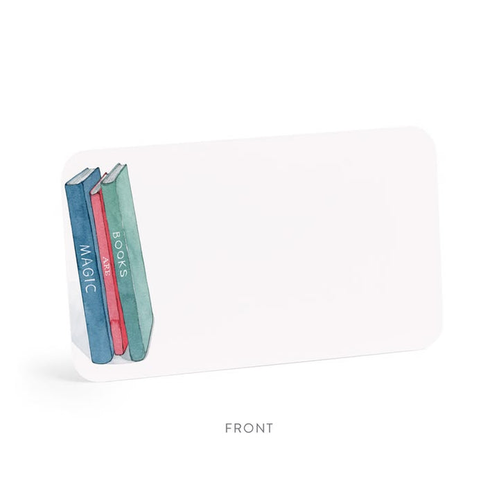A white rectangular desk organizer with rounded corners, featuring a printed graphic of three books on the left side. The organizer is shown from the front on a clean white background with a soft shadow, and the word 'FRONT' is printed below.