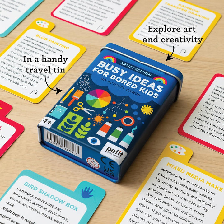Box of 'Busy Ideas for Bored Kids' activity cards on a wooden surface with cards displayed around it.