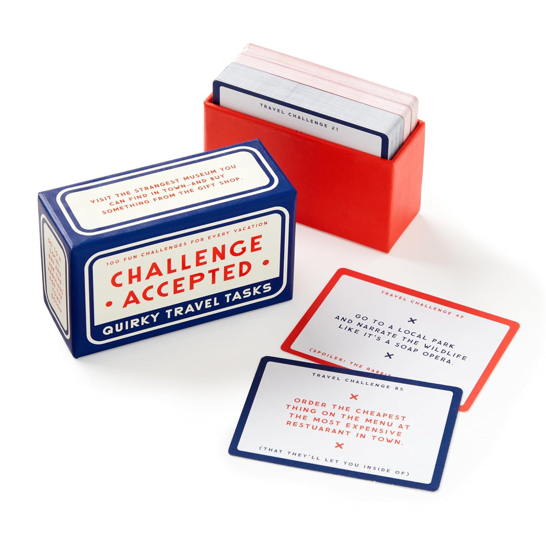 Quirky travel tasks card game with cards and packaging on a white background