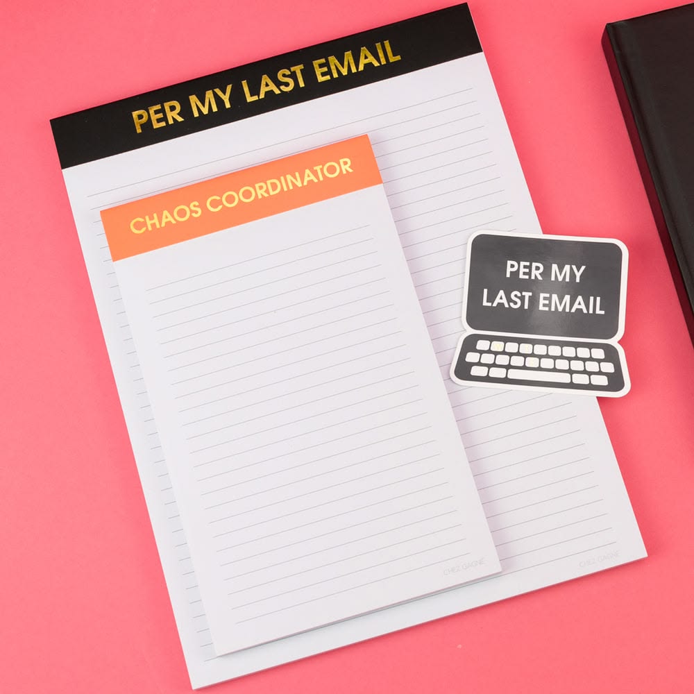 Notebook with 'Per My Last Email' and 'Chaos Coordinator' stickers on a pink background
