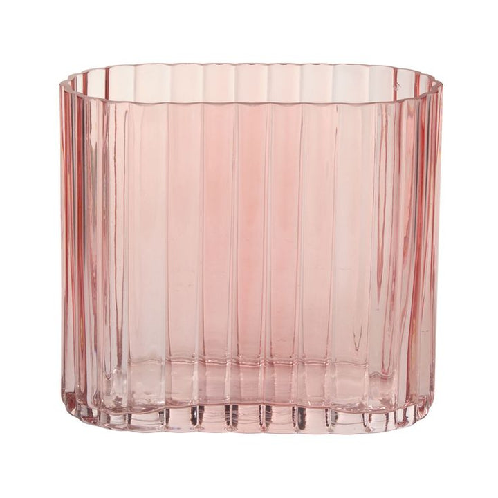 Pink cylindrical glass vase on a white background