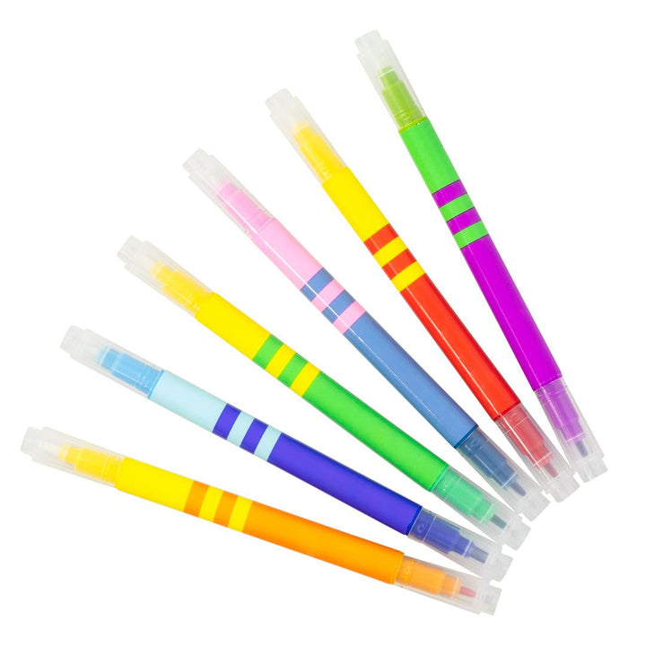 Set of colorful markers with transparent bodies on a white background